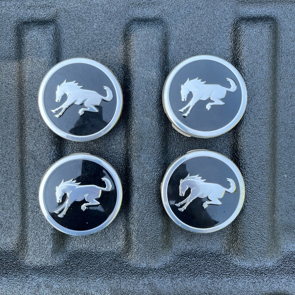 Set of 4 Black Silver BRONCO Horse Center Caps.